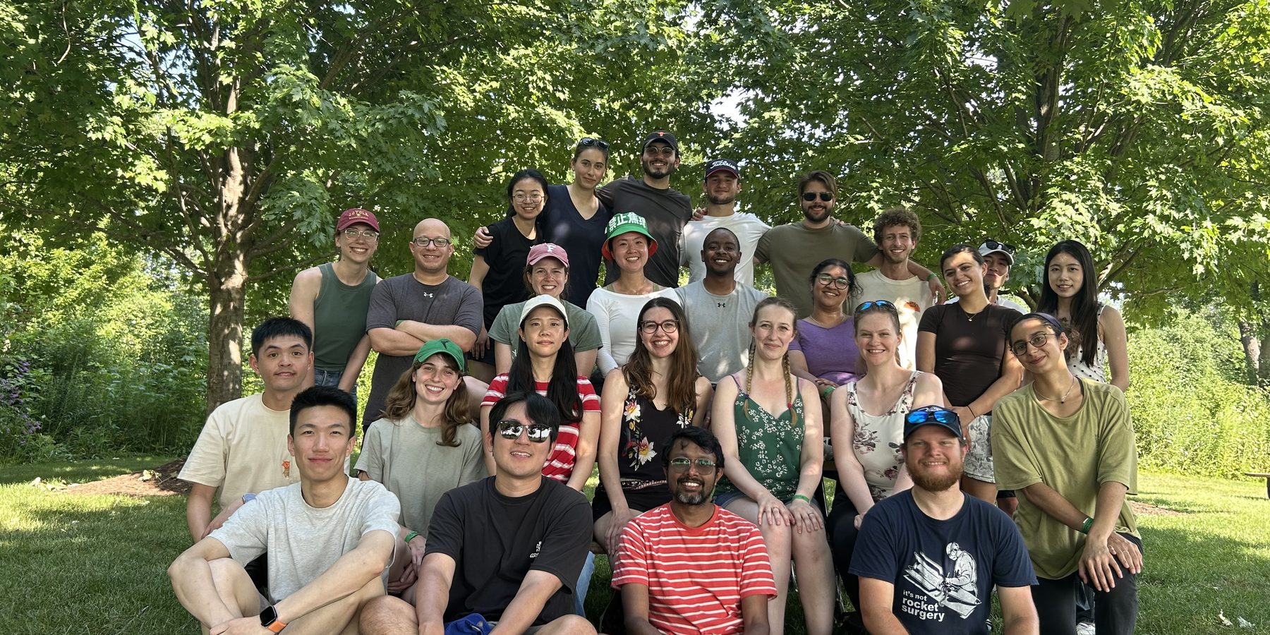 The Rivnay Group outdoors under trees